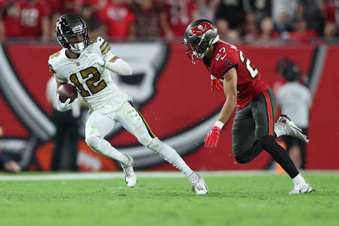 New Orleans Saints wide receiver Chris Olave (12) is chased by Tampa Bay Buccaneers cornerback Zyon McCollum (27). Mandatory Credit: Nathan Ray Seebeck-USA TODAY Sports